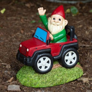 funny gnome in jeep for garden