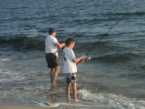 Father and son fishing on the fishing beach.