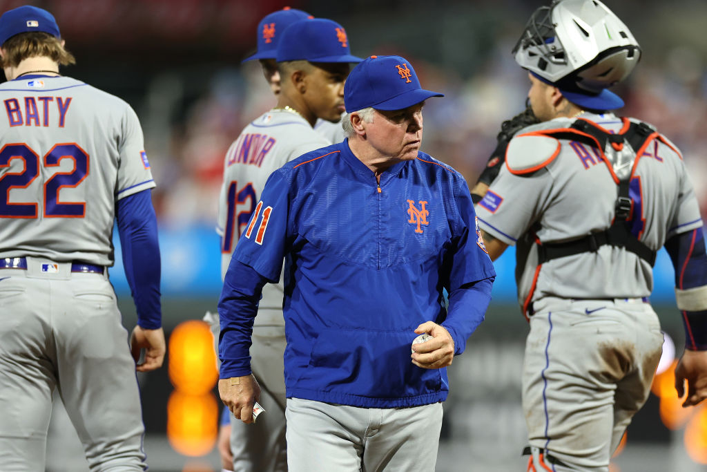 Major League umpire Erich Bacchus looks on during the game between News  Photo - Getty Images