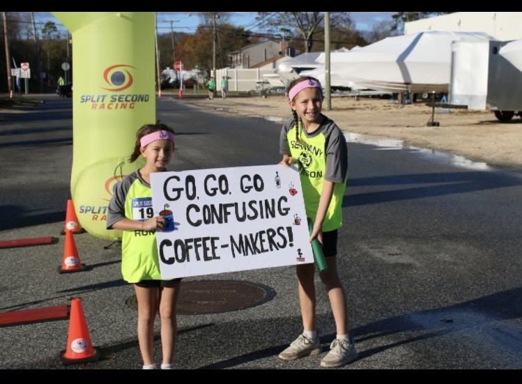 Cheering on a team with signs.