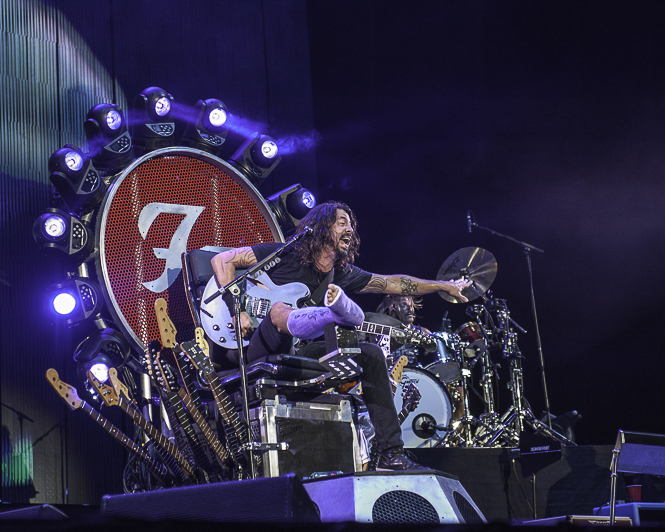 Dave Grohl on his Foo Fighters throne, which he needed when he had a fractured leg.