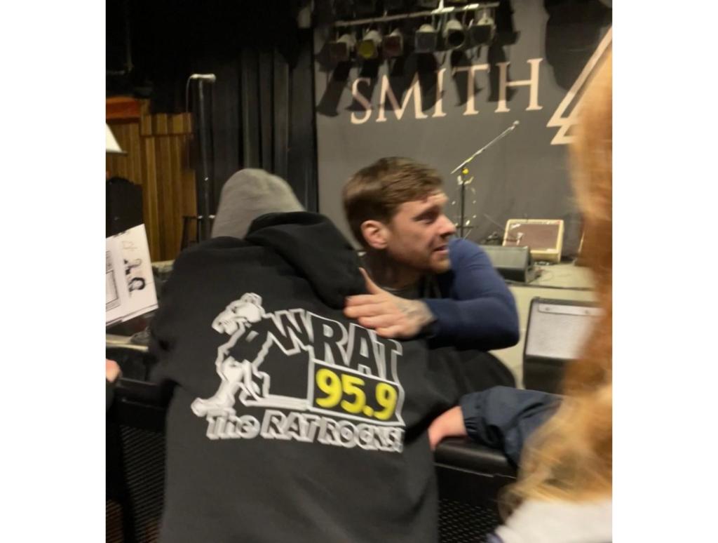 Brent Smith Shares A Hug With Gotts In His Rat Shirt.