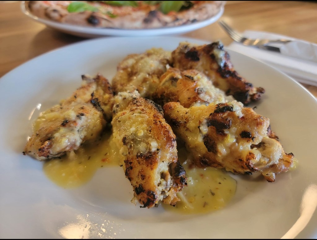  new pizza restaurant selling mouthwatering pizza on Bridge Ave in Point Pleasant. Pictured: A plate of Limoncello wings